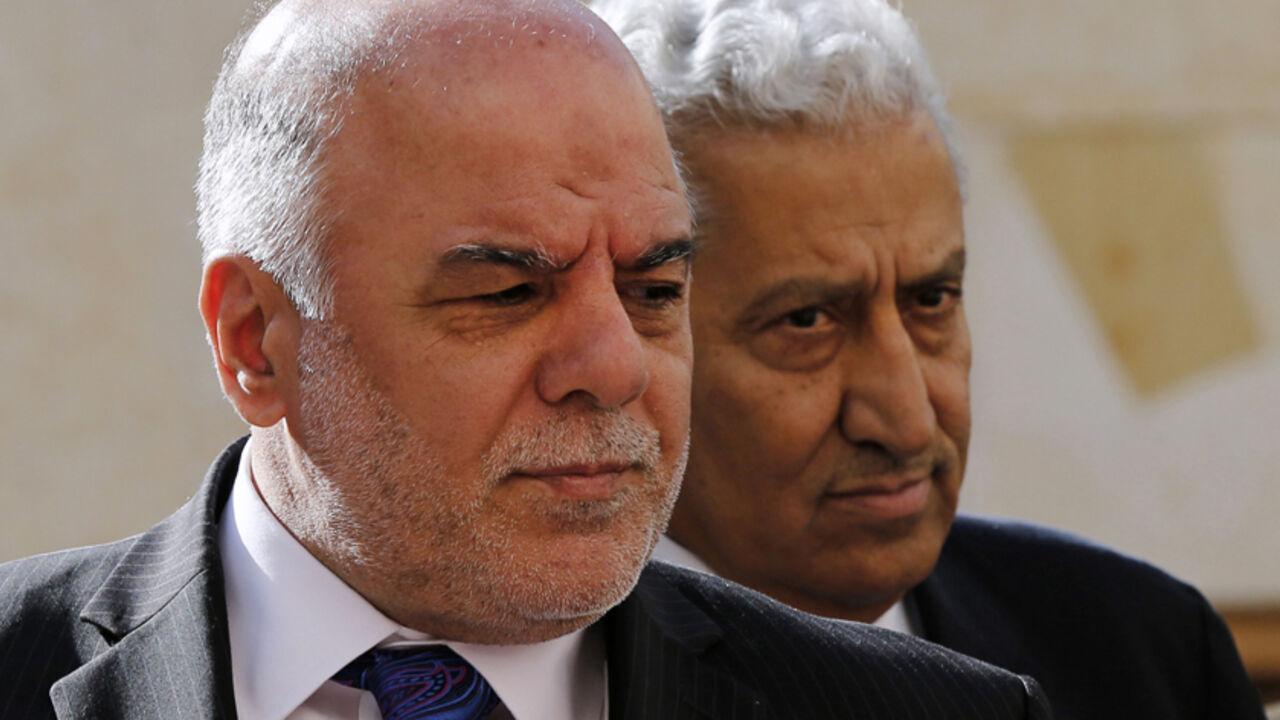 Jordan's Prime Minister Abdullah Ensour (R) walks with his Iraqi counterpart Haider al-Abadi upon their arrival to meet with Jordan's King Abdullah at the Royal Palace in Amman October 26, 2014. REUTERS/Muhammad Hamed (JORDAN - Tags: POLITICS) - RTR4BMVV
