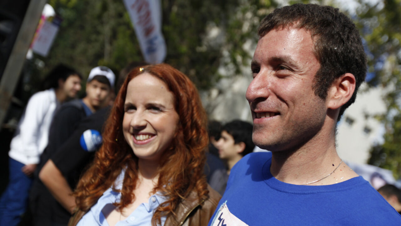 Labour party candidates Itzik Shmuli (R) and Stav Shaffir attend a mock election at a high school in Ramat Gan near Tel Aviv December 6, 2012. The leaders of a grassroots social protest movement that swept Israel in 2011, Shaffir and Shmuli, have shot to the top of a rejuvenated Labour party that polls say will at least double its power in a Jan. 22 general election that Prime Minister Benjamin Netanyahu's right-wing Likud is forecast to win. Picture taken December 6, 2012. REUTERS/Amir Cohen (ISRAEL - Tags