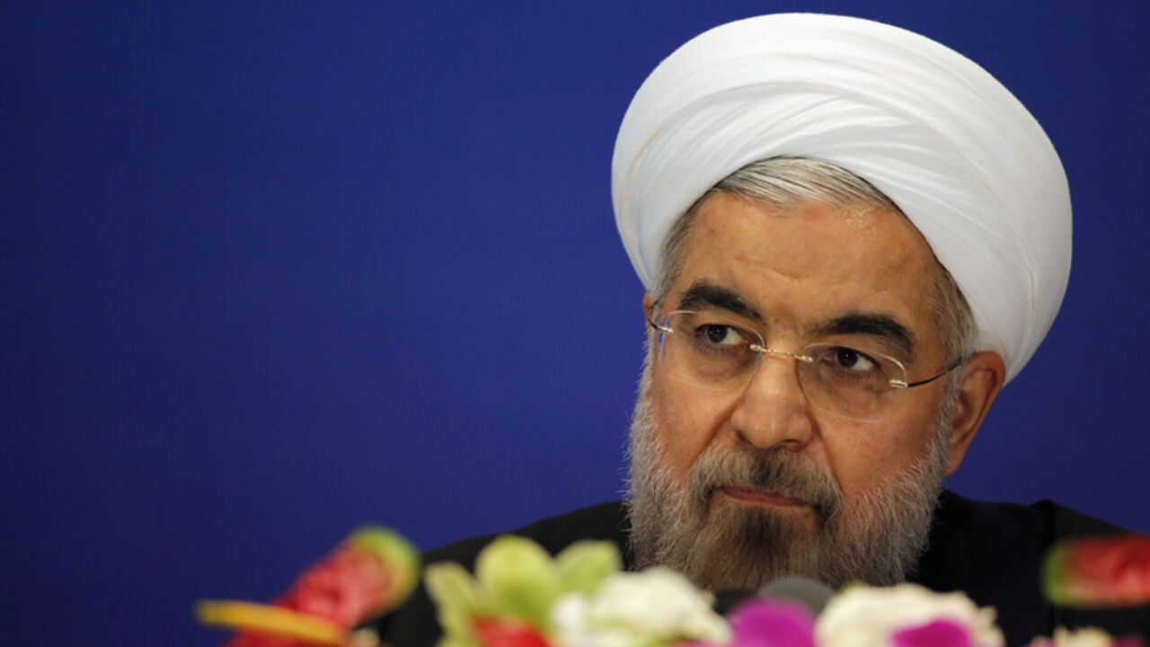 Iran's President Hassan Rouhani arrives to attend a news conference at a hotel after the fourth Conference on Interaction and Confidence Building Measures in Asia (CICA) summit, in Shanghai May 22, 2014. REUTERS/Carlos Barria (CHINA - Tags: POLITICS HEADSHOT) - RTR3QAS5