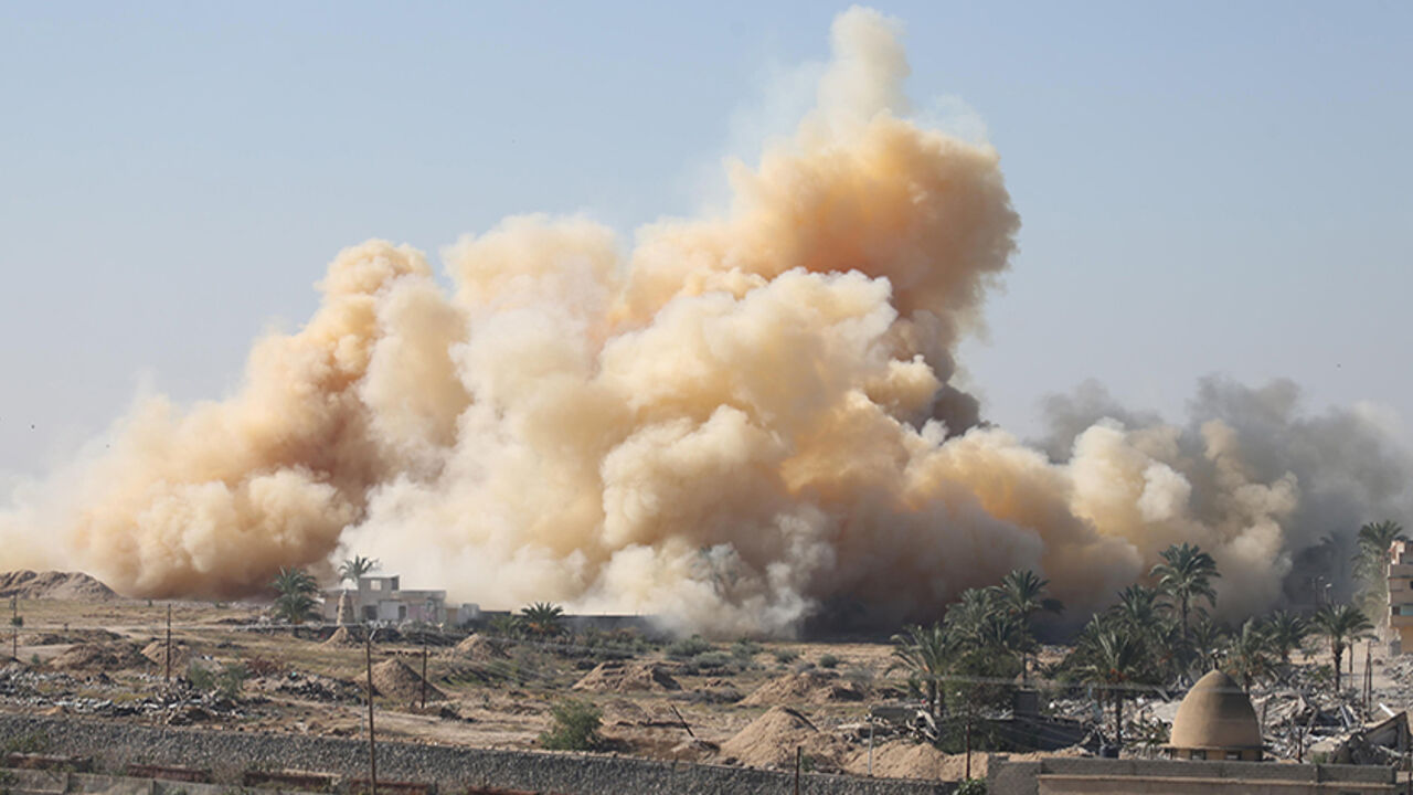 Smoke rises as a house is blown up during a military operation by Egyptian security forces in the Egyptian city of Rafah, near the border with southern Gaza Strip November 6, 2014. At Egypt's border with the Gaza Strip, families are emptying their homes - lugging mattresses and furniture onto waiting vans as soldiers look on from armoured cars. In nine villages along the frontier, 680 houses - homes to 1,165 families - are being razed to seal off smugglers' tunnels and try to crush a militant insurgency in 