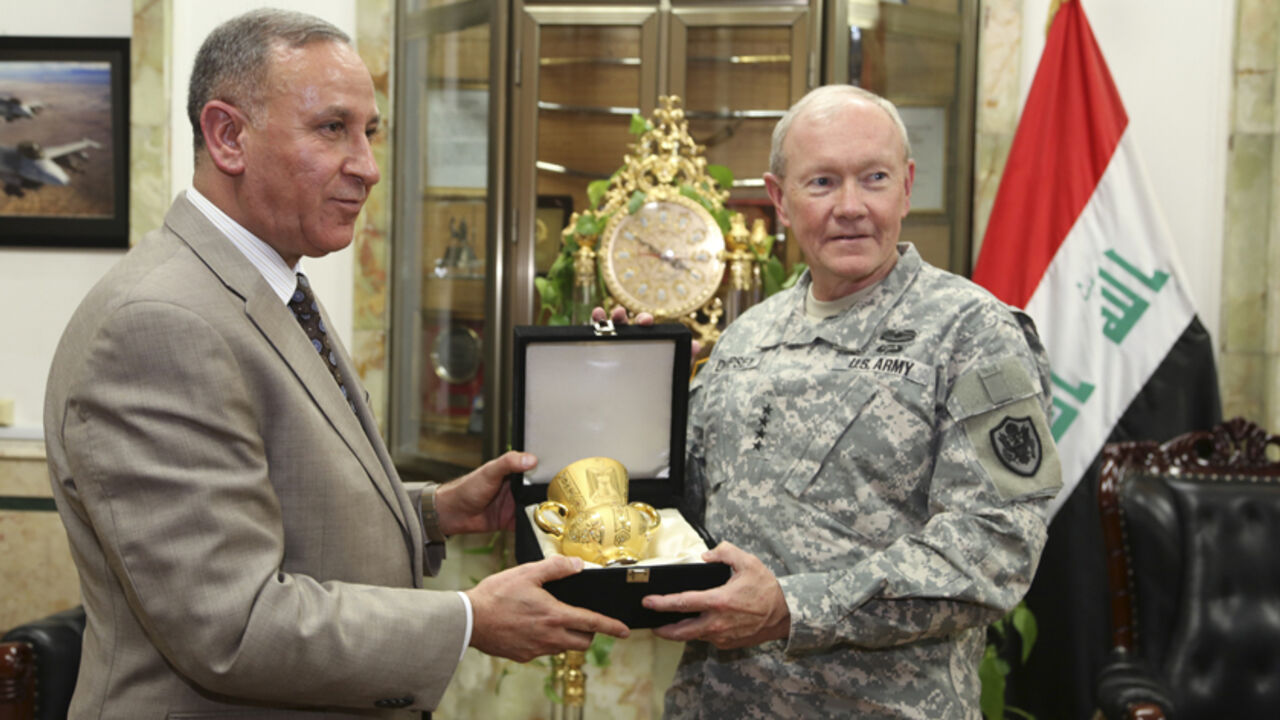 Iraq's Defence Minister Khaled al-Obeidi (L) meets with U.S. Army General Martin Dempsey, chairman of the Joint Chiefs of Staff, at the defence ministry in Baghdad November 15, 2014. Dempsey arrived on Saturday in Baghdad on an unannounced visit to meet U.S. commanders preparing to increase American assistance to Iraqi and Kurdish forces battling Sunni Islamic State (IS) militants.  REUTERS/Stringer   (IRAQ - Tags: POLITICS MILITARY CIVIL UNREST CONFLICT) - RTR4E991
