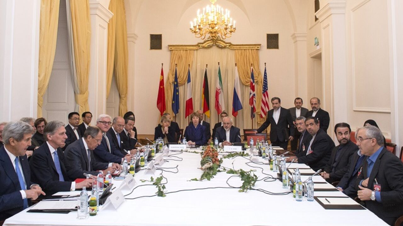Delegations of US Secretary of State John Kerry, Britain's Foreign Secretary Philip Hammondm, Russian Foreign Minister Sergei Lavrov, Iranian Foreign Minister Mohammad Javad Zarif,German Foreign Minister Frank-Walter Steinmeier, French Foreign Minister Laurent Fabius, European Union High Representative Catherine Ashton, Chinese Foreign Minister Wang Yi sit around the negotiations table during their meeting  in Vienna on November 24, 2014. Iran and world powers looked likely Monday to miss a midnight deadlin