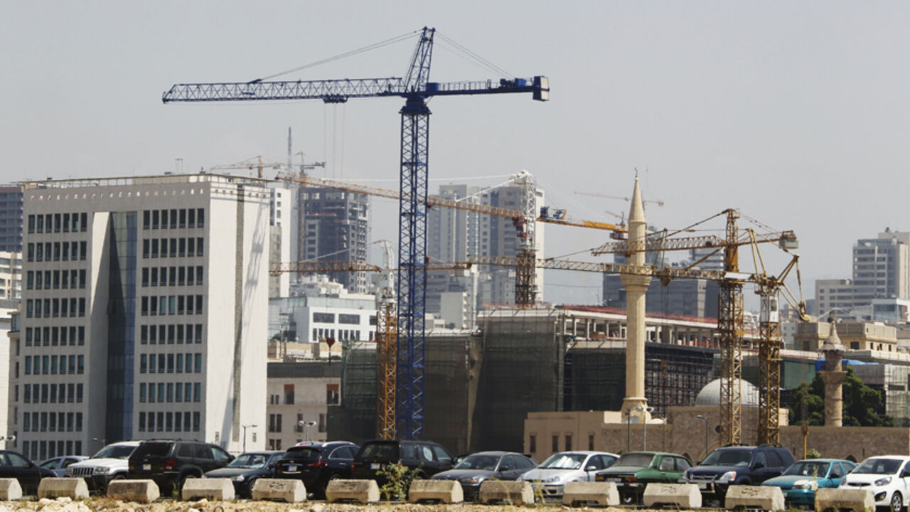Cranes at construction sites of Solidere, a Lebanese company responsible for the development and reconstruction of Beirut's city center, are seen in downtown Beirut July 10, 2012. Gulf investors, an important source of capital for Lebanon, are pulling out of the country, disillusioned by political instability and disappointing economic policies. Lebanon depends heavily on foreign direct investment to offset its current account deficit, its shortfall in trade of goods and services. Lebanon's economy is belie
