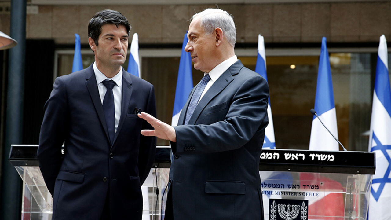 Israeli Prime Minister Benjamin Netanyahu (R) talks with French Ambassador to Israel Patrick Maisonnave after presenting his condolences, following a shooting by gunmen at the offices of weekly satirical magazine Charlie Hebdo in Paris, at Netanyahu's residence in Jerusalem January 9, 2015. The two main suspects in the Charlie Hebdo killings were sighted on Friday in the northern French town of Dammartin-en-Goele where at least one person had been taken hostage, a police source said. REUTERS/Thomas Coex/Poo
