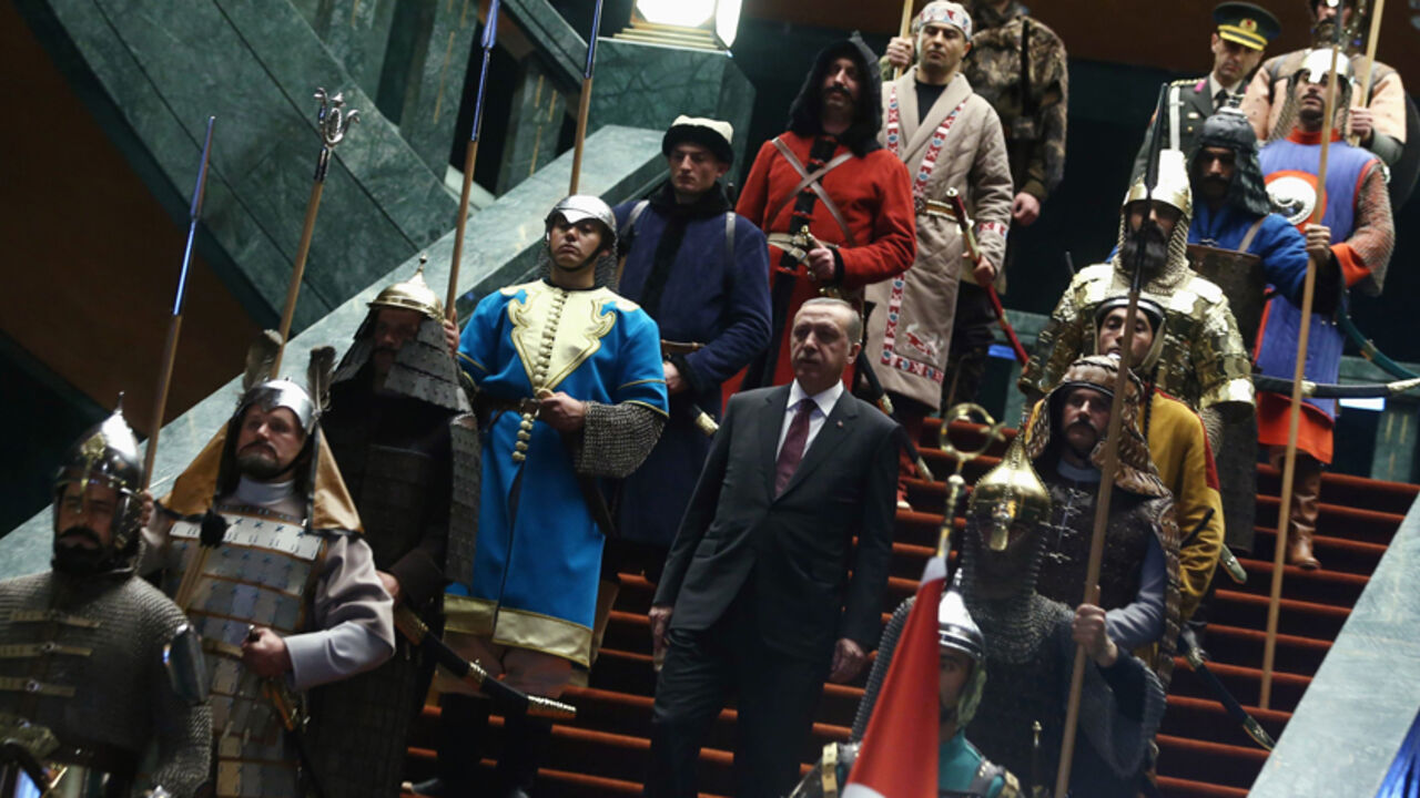 Turkey's President Tayyip Erdogan walks down the stairs in between soldiers, wearing traditional army uniforms from the Ottoman Empire, as he arrives for a welcoming ceremony for Palestinian President Mahmoud Abbas (not pictured) at the Presidential Palace in Ankara January 12, 2015. REUTERS/Adem Altan/Pool (TURKEY - Tags: POLITICS) - RTR4L487