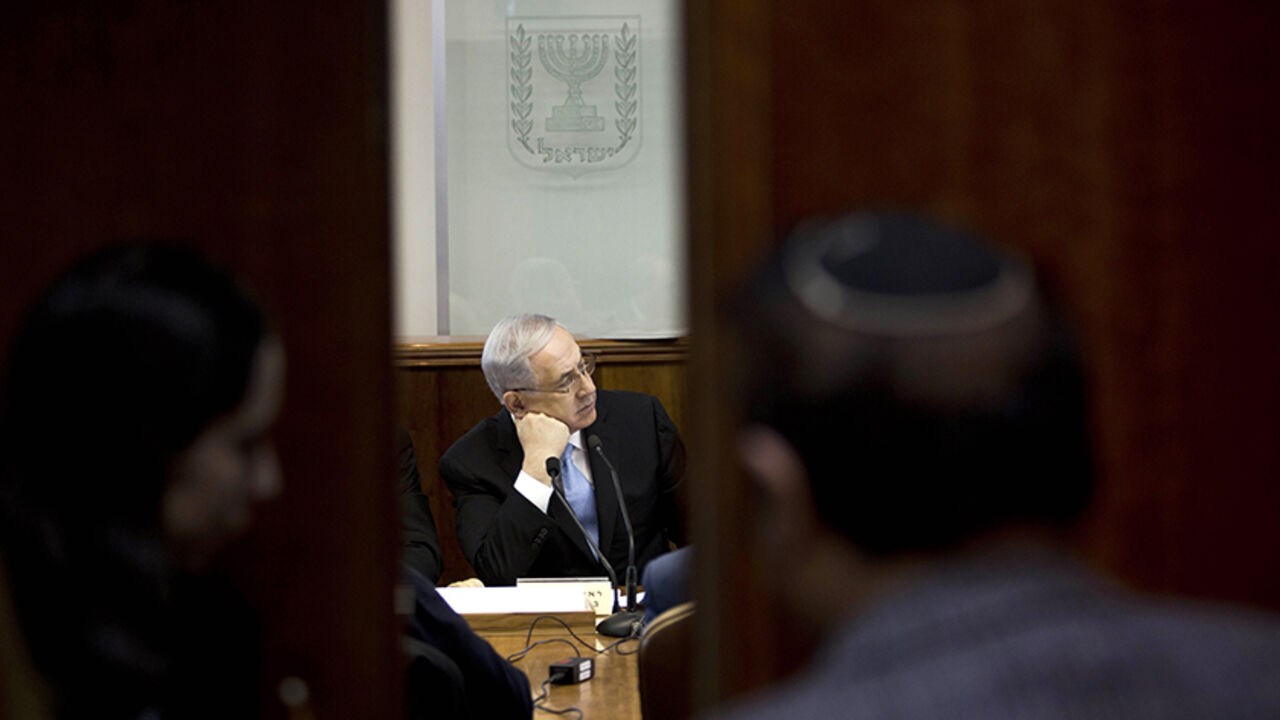 Israel's Prime Minister Benjamin Netanyahu  attends the weekly cabinet meeting at his office in Jerusalem January 18, 2015. Israel is lobbying member-states of the International Criminal Court to cut funding for the tribunal in response to its launch of an inquiry into possible war crimes in the Palestinian territories, officials said on Sunday. REUTERS/Abir Sultan/Pool (JERUSALEM - Tags: POLITICS CRIME LAW) - RTR4LUYJ