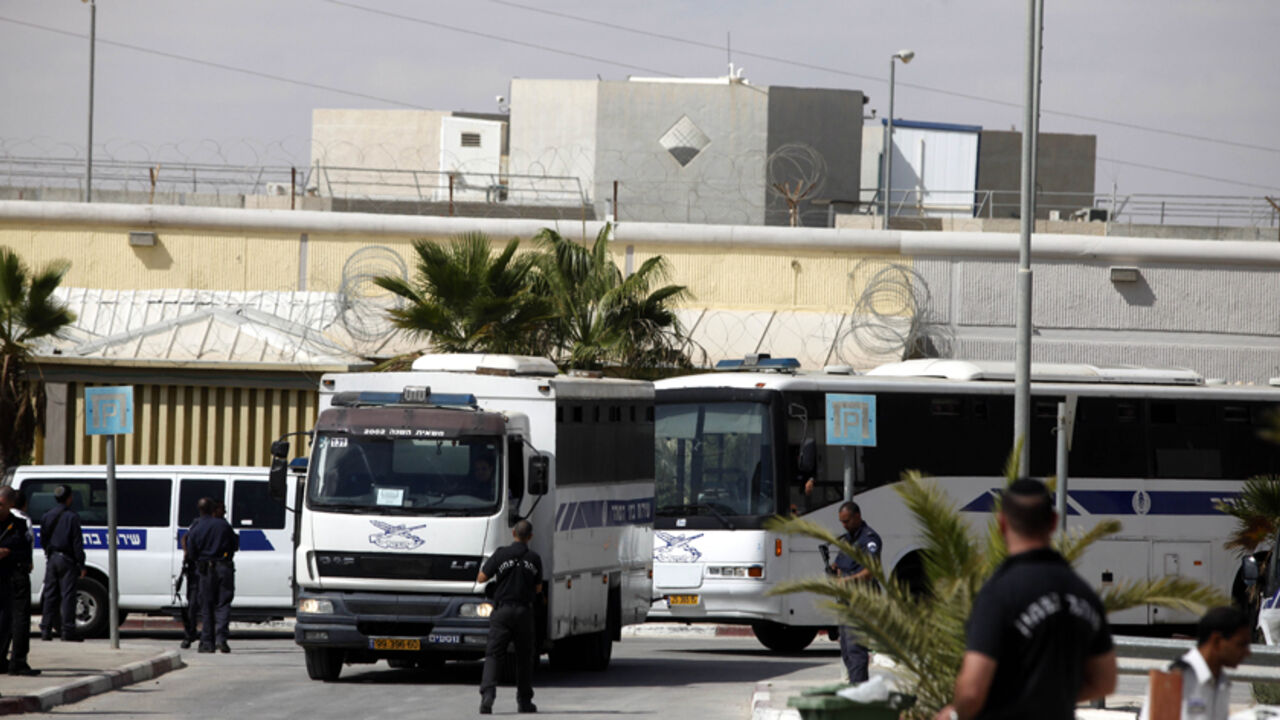 MITZPE RAMON, ISRAEL - OCTOBER 16: (ISRAEL OUT) Israeli Prison Service bus carrying Palestinians prisoners leaves Nafha prison on October 16, 2011. in Mitzpe Ramon, Israel. IDF soldier Gilad Shalit is to be freed from 5 years of captivity in Gaza in an exchange deal which will see the release of 477 Palestinian prisoners in an initial deal with another 550 to freed after the return of Shalit.  (Photo by Lior Mizrahi/Getty Images)