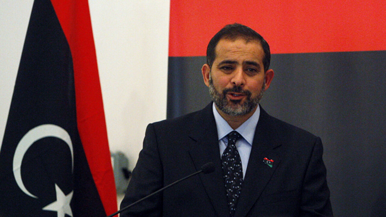 The representative of the National Transitional Council, New Libyan Ambassador to the United Arab Emirates Aref Ali Nayed (L) speaks during a news conference next to Libyan Stabilization Minister Ahmed Jehani (R) at Libyan consulate, in Dubai August 21, 2011. REUTERS/Mosab Omar (UNITED ARAB EMIRATES - Tags: POLITICS CIVIL UNREST) - RTR2Q6H4