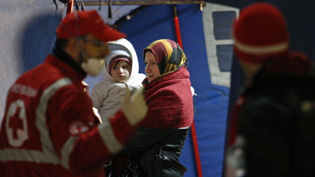 Migrants receive assistance after disembarking from the Sierra Leone-flagged vessel Ezadeen at the Corigliano Calabro harbor, southern Italy January 3, 2015. The ship carrying hundreds of migrants arrived in the southern Italian port of Corigliano Calabro on the evening of January 2 after being abandoned by its crew in rough seas in the Mediterranean off Italy's south coast in the second such incident in three days.    REUTERS/Antonino Condorelli (ITALY - Tags: SOCIETY IMMIGRATION CRIME LAW POLITICS MARITIM