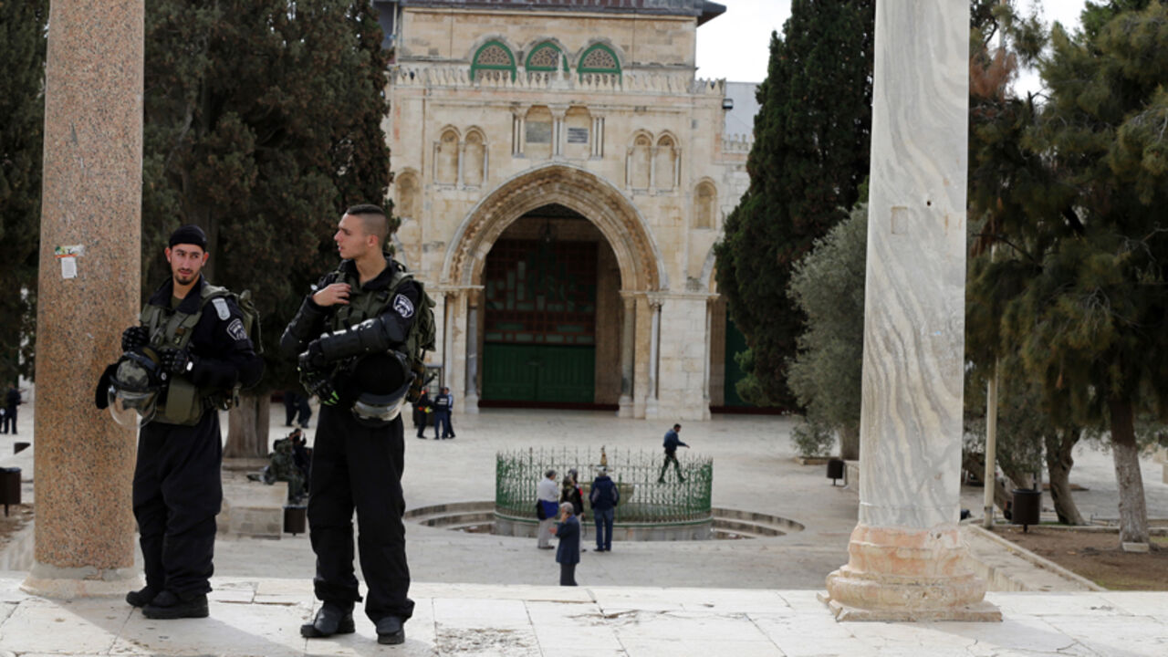 Israeli police officers stand guard on the compound known to Muslims as Noble Sanctuary and to Jews as Temple Mount in Jerusalem's Old City November 5, 2014. As Jordan joins a military campaign against Islamic State militants in Syria, tensions in Jerusalem pose a potentially bigger risk to a nation only slightly scathed by the turmoil sweeping the Middle East. Picture taken November 5, 2014.
To match Insight MIDEAST-CRISIS/JORDAN-STABILITY 
REUTERS/Ammar Awad (JERUSALEM - Tags: MILITARY POLITICS RELIGION C