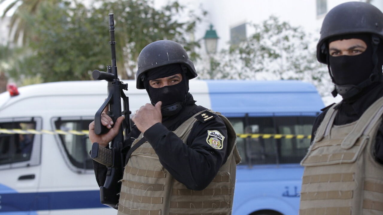Tunisian policemen stand guard at the entrance of the Bardo national museum in Tunis March 19, 2015. Tunisia said it would deploy the army to major cities and arrested four people on Thursday after militant gunmen killed 20 foreign tourists visiting the national Bardo museum, the worst attack on the north African country in more than a decade. REUTERS/Anis Mili - RTR4U1PF