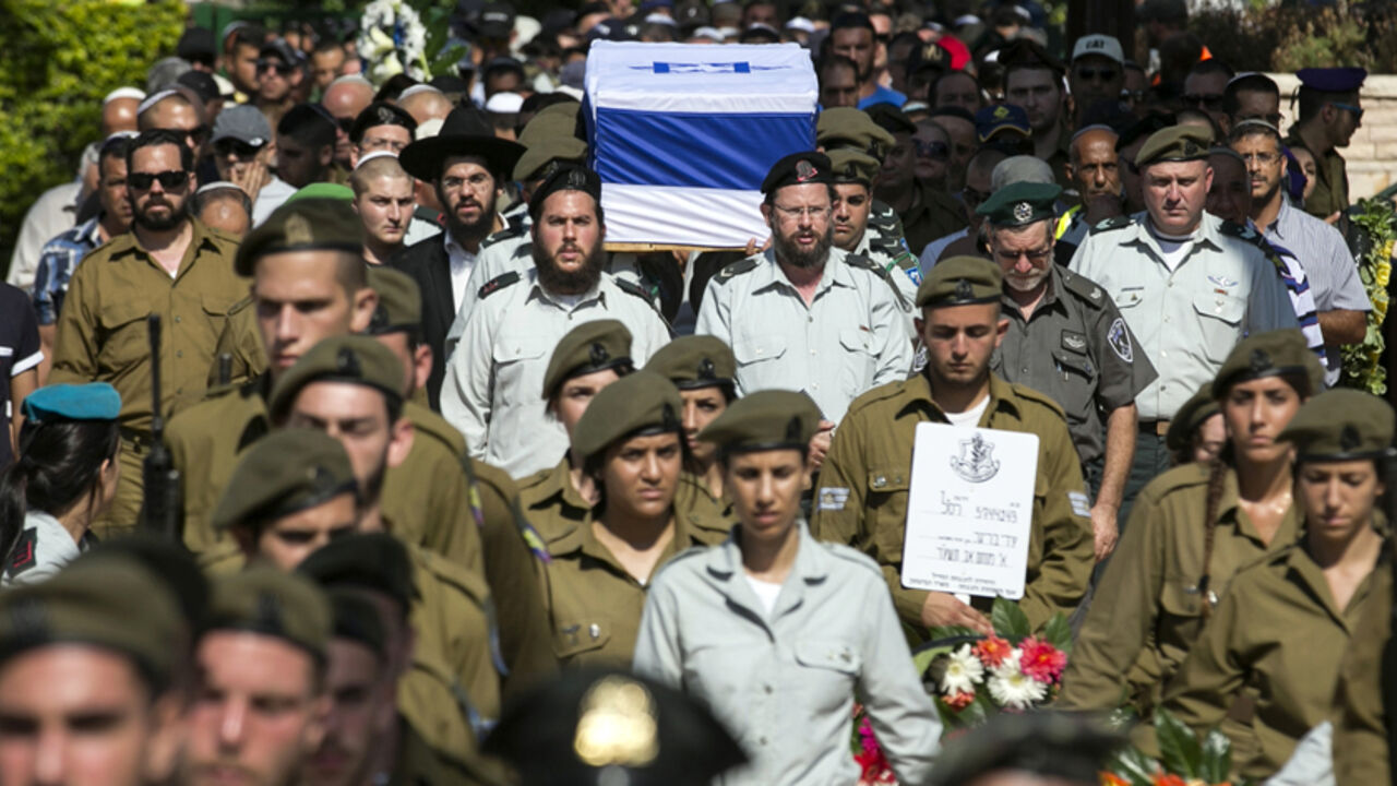 Relatives and friends attend the funeral of Israeli soldier Adi Briga who was killed on Monday by a Palestinian mortar strike from the Gaza Strip in Ashkelon July 29, 2014. Israel knocked out Gaza's only power plant, flattened the home of its Islamist Hamas political leader and pounded dozens of other high-profile targets in the enclave on Tuesday, with no end in sight to more than three weeks of conflict. A number of rockets were fired from Gaza toward southern and central Israel, including the Tel Aviv ar