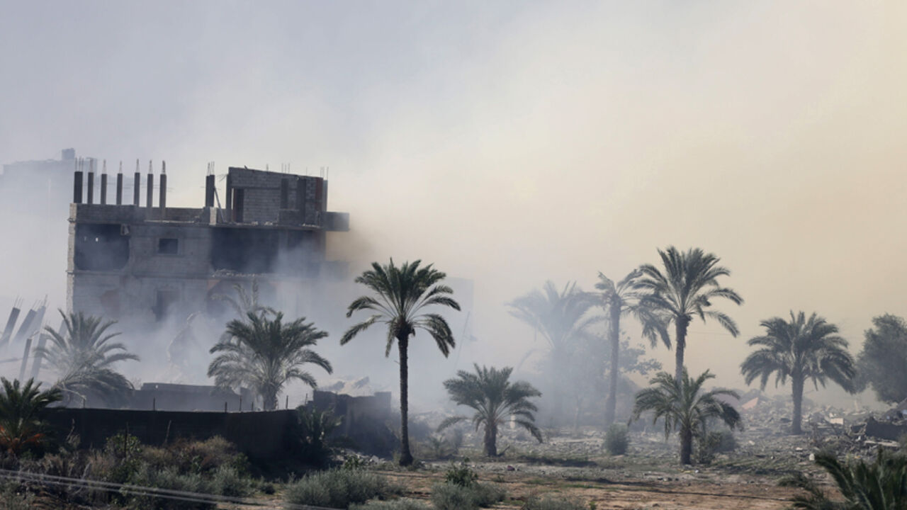 Smoke rises after a house is blown up during a military operation by Egyptian security forces in the Egyptian city of Rafah, near the border with southern Gaza Strip November 6, 2014. At Egypt's border with the Gaza Strip, families are emptying their homes - lugging mattresses and furniture onto waiting vans as soldiers look on from armoured cars. In nine villages along the frontier, 680 houses - homes to 1,165 families - are being razed to seal off smugglers' tunnels and try to crush a militant insurgency 