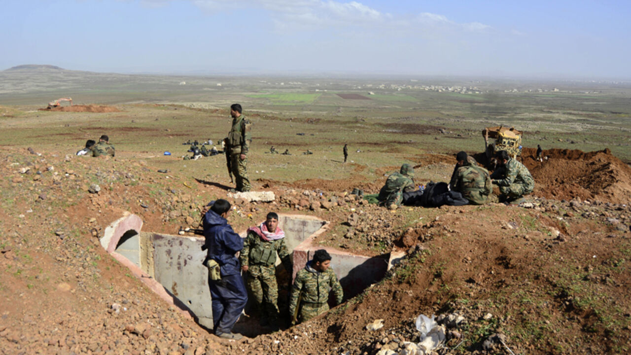 Fighters loyal to Syria's President Bashar Al-Assad rest on a hill after regaining control of Tal Fatima, a town south of Damascus, in the Daraa countryside March 1, 2015. Government forces say they've regained control of this and many other villages in the south - wresting them back from rebel hands.A general made the announcement on state television, saying a large number of Nusra Front fighters were killed and their weapons destroyed. The gains were said to happen on Friday and Saturday in a large offens