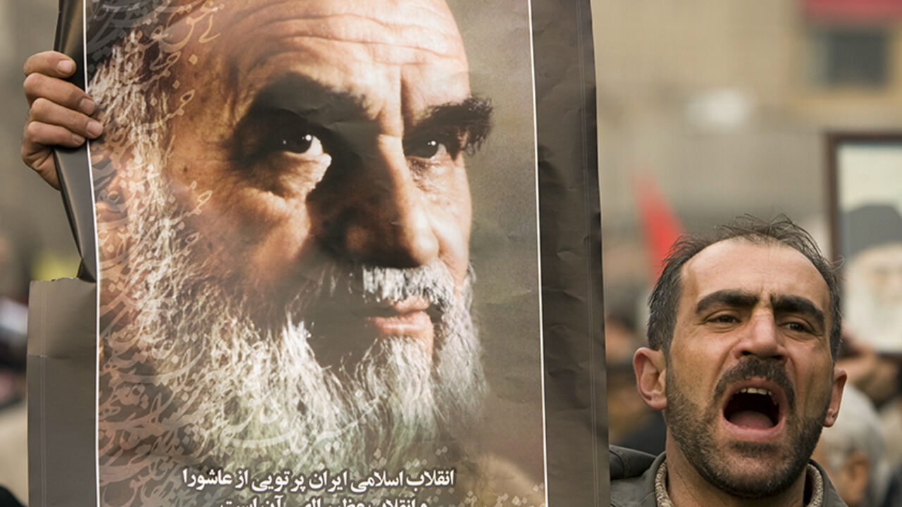 EDITORS' NOTE: Reuters and other foreign media are subject to Iranian restrictions on leaving the office to report, film or take pictures in Tehran. 

A man holds a picture of Ayatollah Ruhollah Khomeini, founder of the Islamic Republic as government supporters protest against opposition demonstrations during the holy day of Ashura, in Tehran December, 30 2009.  REUTERS/Caren Firouz  (IRAN - Tags: POLITICS CIVIL UNREST) - RTR28FLB