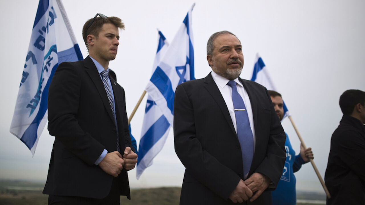 Israel's Foreign Minister and head of Yisrael Beitenu party Avigdor Lieberman stands on a hill overlooking the Gaza Strip, as he campaigns in the southern town of Sderot February 23, 2015. REUTERS/Amir Cohen (ISRAEL - Tags: POLITICS ELECTIONS) - RTR4QSP0