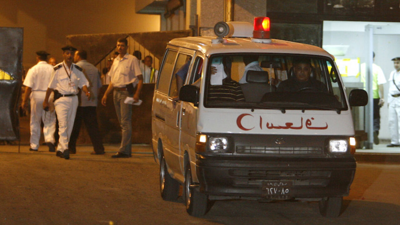 Police guard an ambulance carrying the body of a pregnant Egyptian woman killed in a Dresden courthouse arriving for burial, at Cairo airport, July 5, 2009. Dresden prosecutors have charged a German-Russian man with fatally stabbing Marwa al-Shirbini, 31, in a courthouse in Dresden on Wednesday. The woman was at the court to testify against him on charges that he had called her a "terrorist" on a playground in 2008 because she was wearing a headscarf . REUTERS/Asmaa Waguih (EGYPT POLITICS CONFLICT) - RTR25C