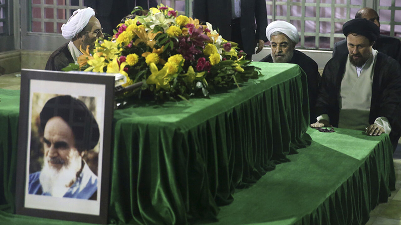 Iranian President-elect Hassan Rouhani (2nd R) pays his respects to the grave of the founder of the Islamic Republic Ayatollah Ruhollah Khomeini at his mausoleum in Tehran June 16, 2013. Reuters/Fars News/Seyed Hassan Mousavi   (IRAN - Tags: POLITICS) ATTENTION EDITORS - THIS IMAGE WAS PROVIDED BY A THIRD PARTY. FOR EDITORIAL USE ONLY. NOT FOR SALE FOR MARKETING OR ADVERTISING CAMPAIGNS. THIS PICTURE IS DISTRIBUTED EXACTLY AS RECEIVED BY REUTERS, AS A SERVICE TO CLIENTS - RTX10Q4E