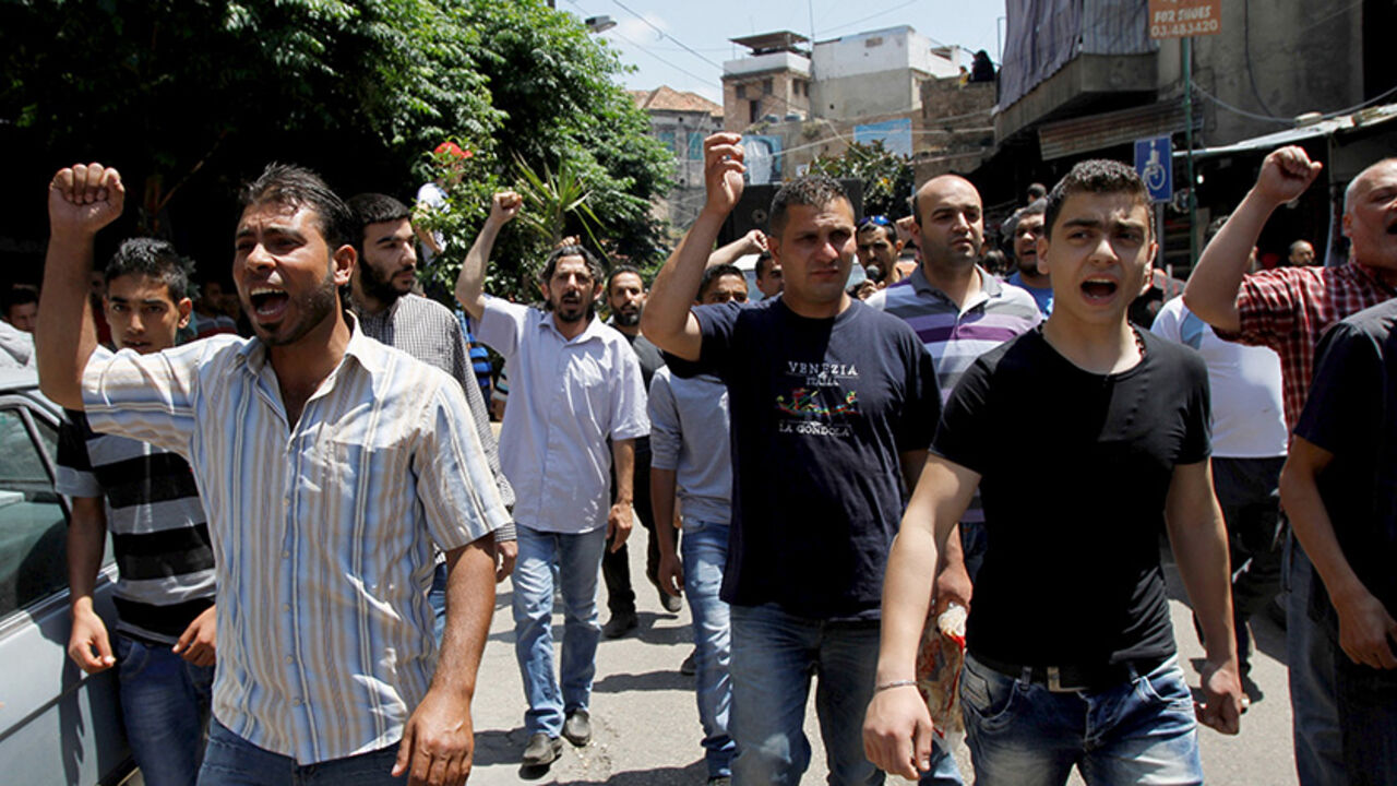 Residents and family members of Islamist militants in Roumieh prison gesture during a protest calling for the release of Islamist militants detained by Lebanese forces, and criticizing the sentence duration of former Lebanese minister Samaha in Tripoli May 15, 2015. Samaha was sentenced on Wednesday to 4 1/2 years in prison for forming a group to carry out terrorist attacks.  REUTERS/Omar Ibrahim - RTX1D3SJ