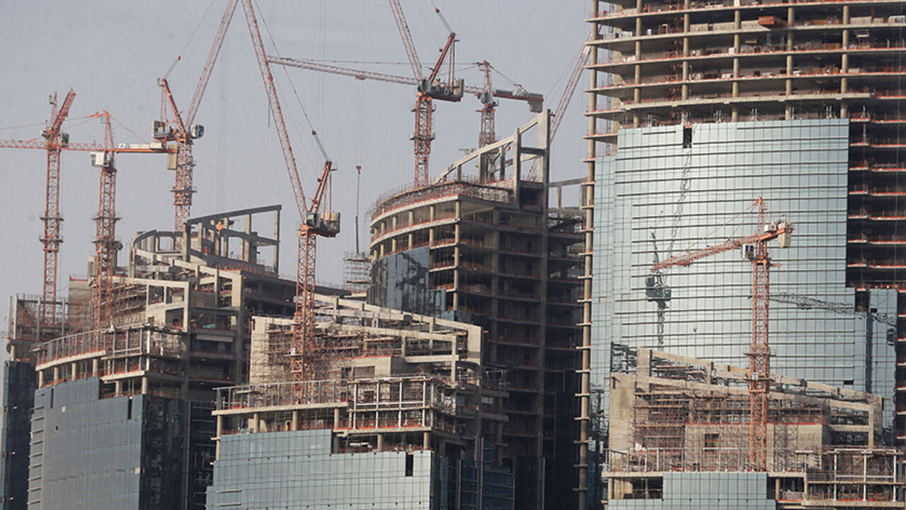 A view shows the Qatar Petroleum headquarters, which is under construction, in Doha April 8, 2013. Bankers and politicians touting their countries' wares have to work hard to get the attention of Qatar's sovereign wealth fund, such is the range of its interests, from banks to cars to soccer clubs, and its exacting requirement for returns. With estimated assets of about $200 billion, and more than a dozen potential deals on its radar every week, the state-run firm has no time for less than compelling investm