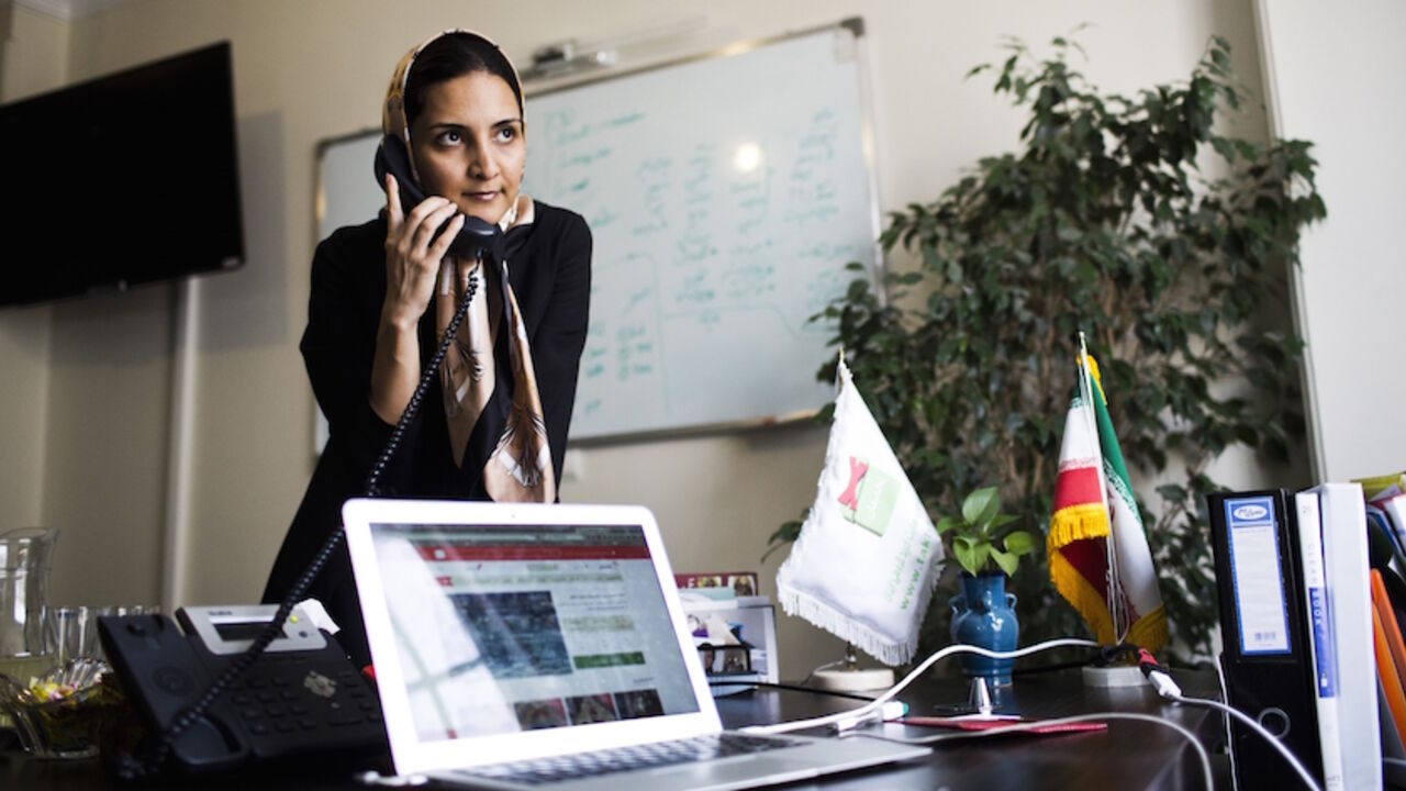 Iranian Nazanin Daneshvar, founder of Takhfifan startup company speaks on the phone in her office in Tehran on July 1, 2015. Women are more likely to start businesses. Very present in senior positions of the Islamic Republic, they are needed in the private sector. It is a continuous parade in office Nazanin Daneshvar. Commerce Site Online Takhfifan Founder - "discount", in Farsi - the young woman engineer in turn receives foreign visitors, journalists and business leaders from discovering Iran before the li