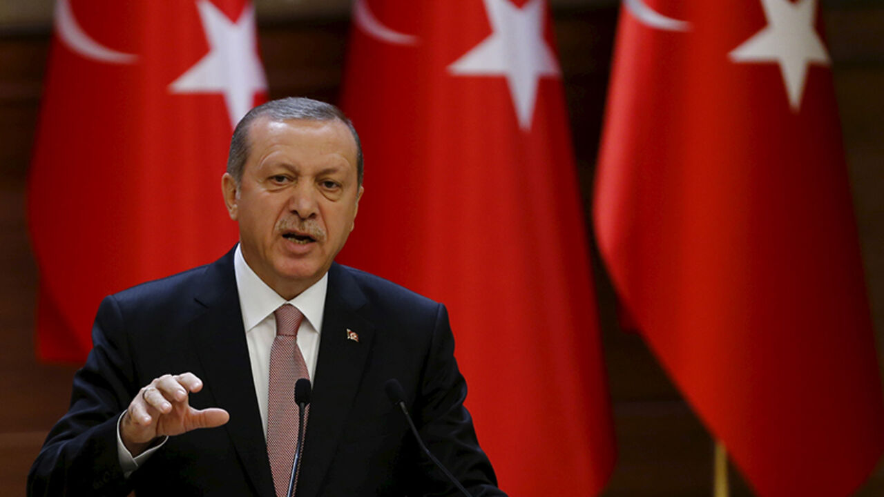 Turkish President Tayyip Erdogan makes a speech during his meeting with mukhtars at the Presidential Palace in Ankara, Turkey, November 26, 2015. Erdogan on Thursday dismissed as "emotional" and "unfitting of politicians" suggestions that projects with Russia could be cancelled in the wake of Turkey's downing of a Russian warplane near the Syrian border. Erdogan said the Russian jet was shot down on Tuesday in an "automatic reaction" in line with standing instructions given to the military. Turkey's militar