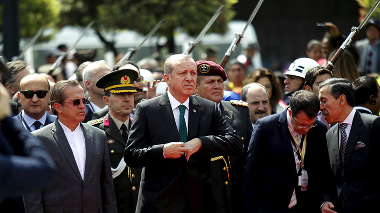 Turkish President Tayyip Erdogan (2nd L) and Ecuador's Foreign Affairs Minister Ricardo Patino (L) attend a diplomatic ceremony in front of Carondelet Palace in Quito, Ecuador, February 4, 2016.REUTERS/Guillermo Granja - RTX25GXK