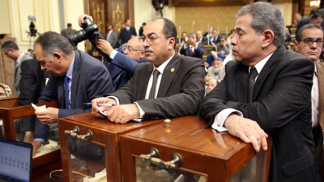 Tawfik Okasha (R), looks onvote to choose the head of the Egypt's Parliament late in Sunday's procedural and opening session at the main headquarters of Parliament in Cairo, Egypt, January 10, 2016. Meeting for the first time in more than three years, Egypt's new parliament on Sunday elected a constitutional expert as its speaker, a key position as President Abdel Fattah al-Sisi looks to push through more than 200 laws issued by executive decree while the assembly was suspended. REUTERS/Stringer - RTX21RGV