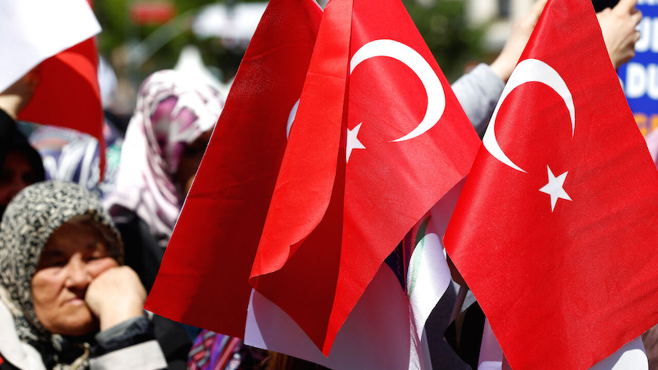 Supporters of Turkish President Tayyip Erdogan (not pictured) wave national flags as they wait for his arrival during an opening ceremony in Istanbul, Turkey May 6, 2016. REUTERS/Murad Sezer - RTX2D4C3