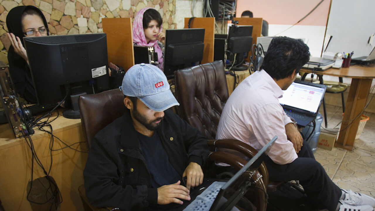 Customers use computers at an internet cafe in Tehran May 9, 2011. Websites like Facebook, Twitter, YouTube and countless others were banned shortly after the re-election of Iran's President Mahmoud Ahmadinejad and the huge street protests that followed. Seen by the government as part of a "soft war" waged by the enemies of the Islamic Republic, social networking and picture sharing sites were a vital communication tool for the anti-Ahmadinejad opposition -- more than a year before they played a similar rol