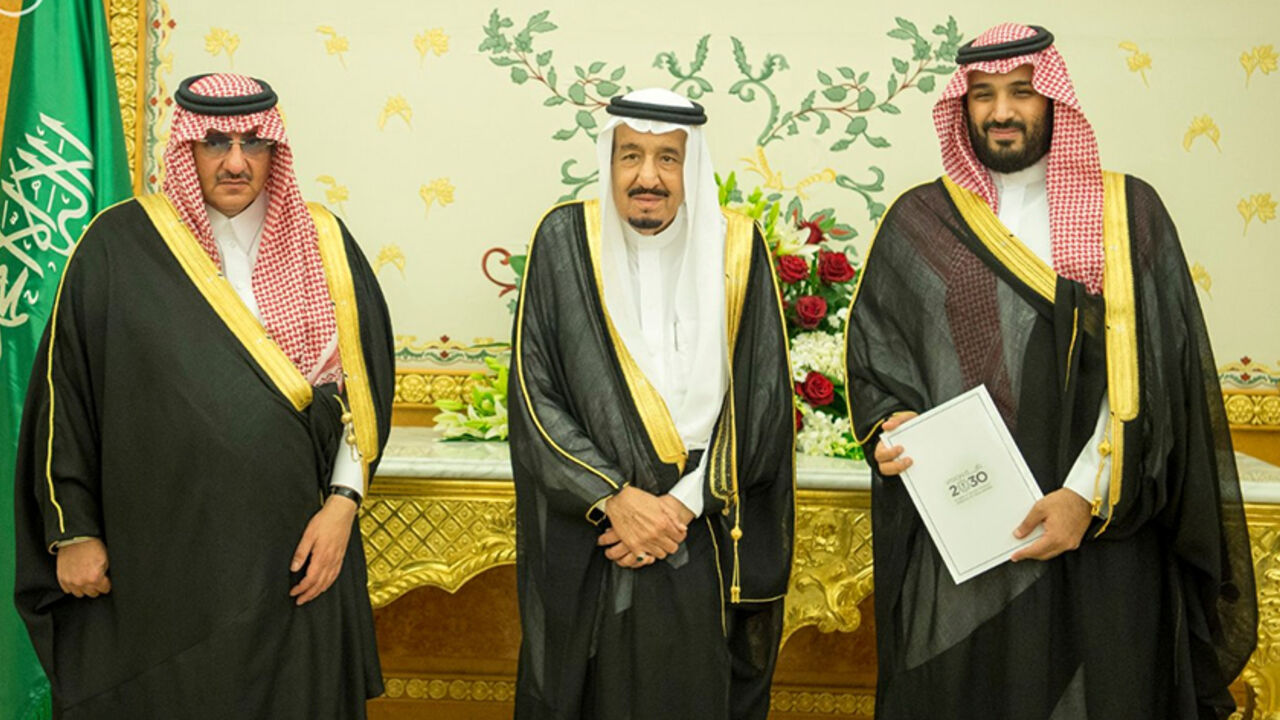 (L-R) Saudi Crown Prince Mohammed bin Nayef, Saudi King Salman, and Saudi Arabia's Deputy Crown Prince Mohammed bin Salman stand together as Saudi Arabia's cabinet agrees to implement a broad reform plan known as Vision 2030 in Riyadh, April 25, 2016. To match Insight SAUDI-PLAN/PRINCE  Saudi Press Agency/Handout/File Photo via REUTERS.    ATTENTION EDITORS - THIS IMAGE WAS PROVIDED BY A THIRD PARTY. EDITORIAL USE ONLY. NO RESALES. NO ARCHIVE.  - RTX2CU2M