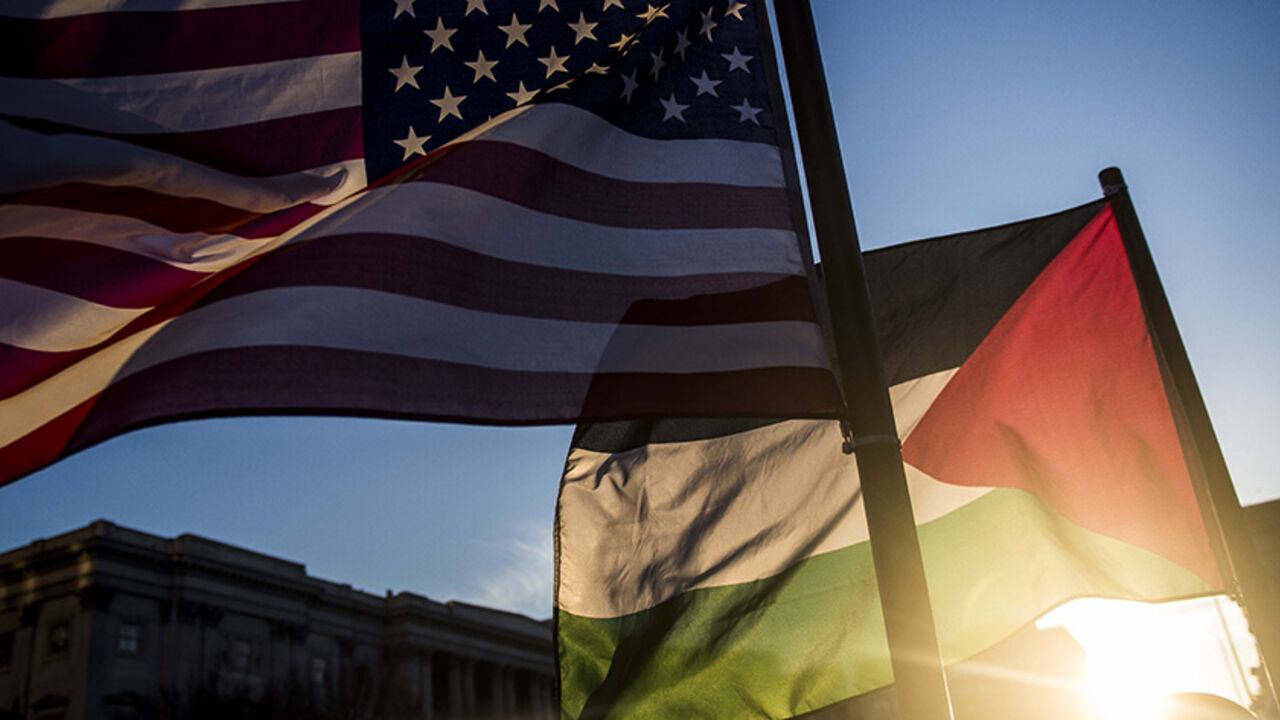 WASHINGTON, DC - MARCH 21: American and Palestinian flags wave outside of the Verizon Center during the American Israel Public Affairs Committee (AIPAC) conference on March 21, 2016 in Washington, D.C. Presidential candidates from both parties gathered in Washington to pitch their plans for Israel.  (Photo by Gabriella Demczuk/Getty Images)