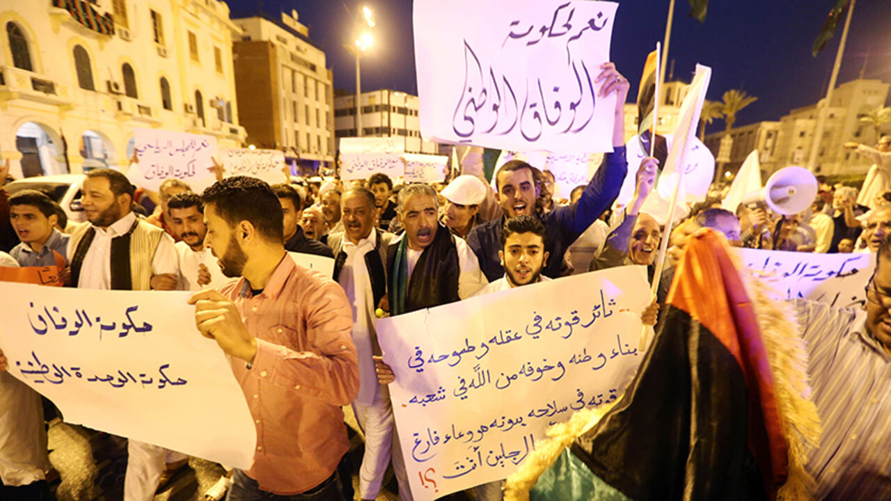 Pro-UN-backed government protesters hold placards and shout slogans during a demonstration in the Libyan capital Tripoli on April 1, 2016.
Hundreds of supporters of the Government of National Accord (GNA) rallied in the capital where the unity cabinet is striving to exert its authority, calling on a rival administration to depart. / AFP / MAHMUD TURKIA        (Photo credit should read MAHMUD TURKIA/AFP/Getty Images)