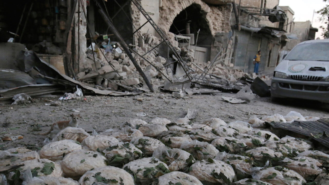 Stacks of bread are seen at a damaged site after an airstrike in the rebel-held Bab al-Maqam neighbourhood of Aleppo, Syria, September 28, 2016. REUTERS/Abdalrhman Ismail     TPX IMAGES OF THE DAY      - RTSPSQQ