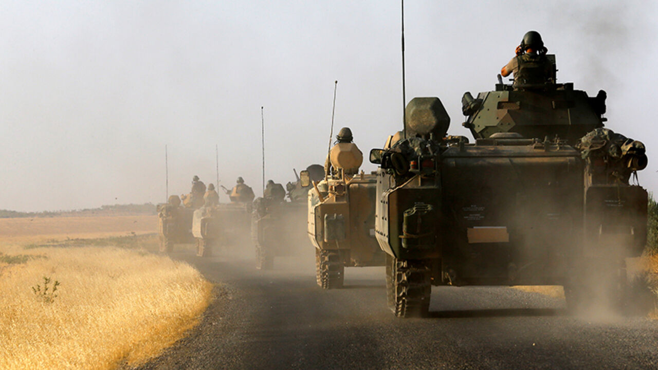 Turkish armoured personnel carriers drive towards the border in Karkamis on the Turkish-Syrian border in the southeastern Gaziantep province, Turkey, August 27, 2016. REUTERS/Umit Bektas  - RTX2N8HX