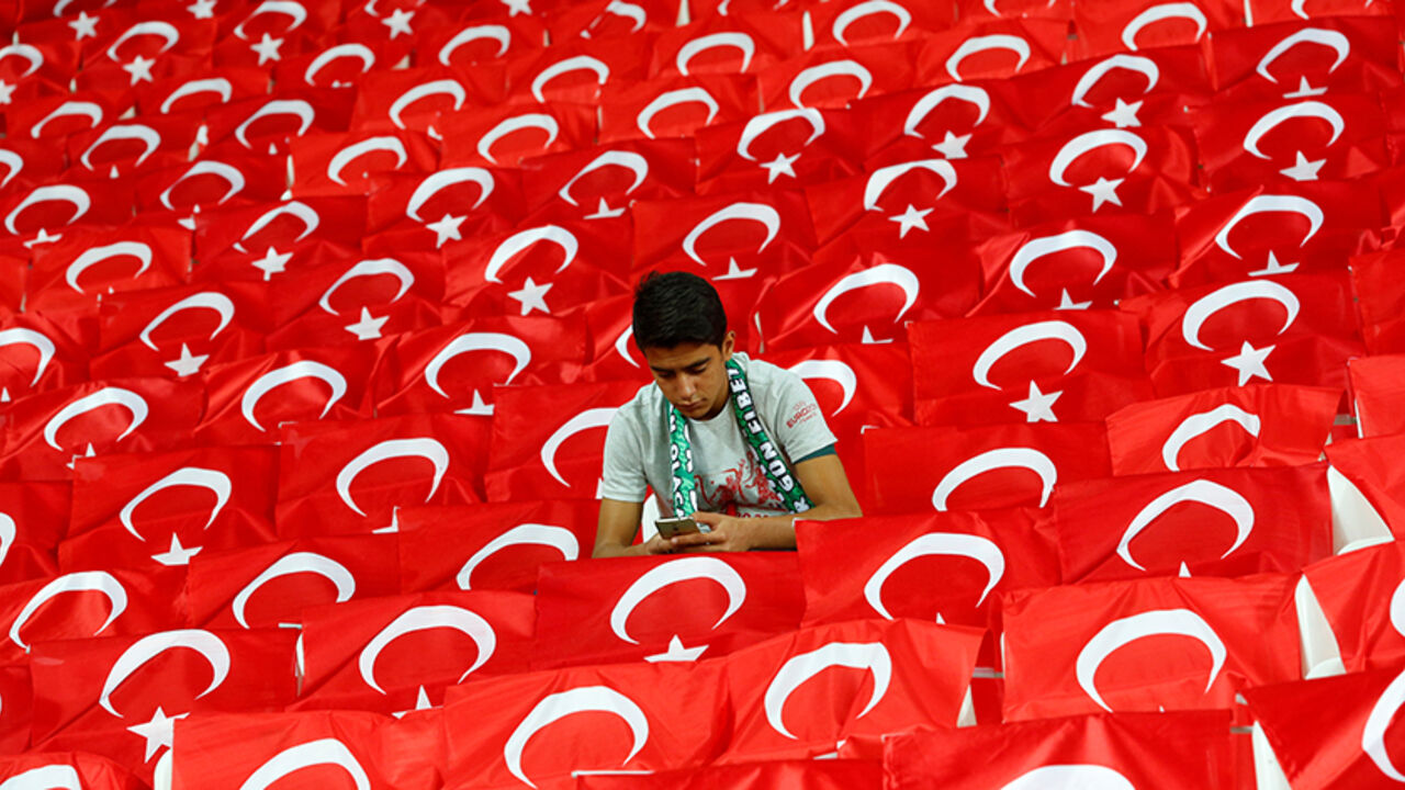 Football Soccer - Turkey v Ukraine - World Cup 2018 Qualifiers - Metropolitan Stadium, Konya, Turkey - 6/10/16. A fan uses his mobile phone before the match. REUTERS/Murad Sezer - RTSR2TZ
