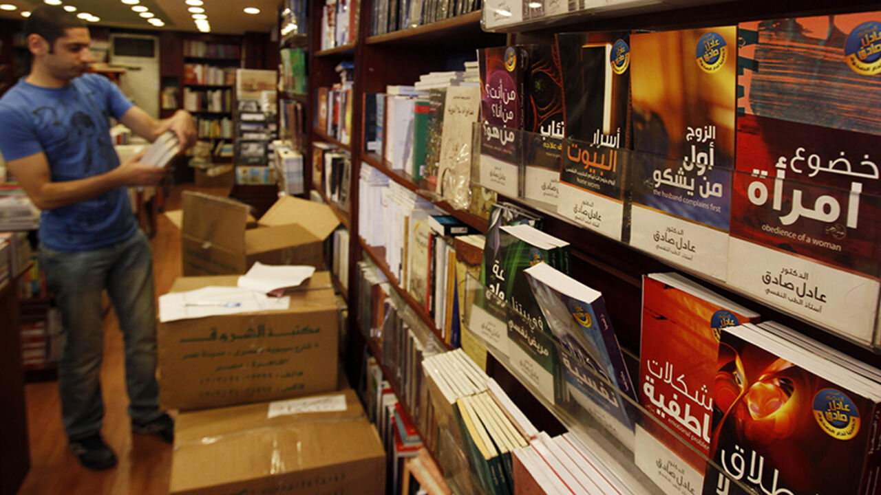 A man browses in a bookshop in downtown Cairo October 13, 2010. Poking fun at everything from the president's almost 30-year rule to the capital's frenetic traffic, satirical books are filling more shelf space in Egypt's bookshops and reflecting the frustrations of a young generation. Limited outlets for political expression, state crackdowns on organized dissent and a growing wealth gap in the Arab world's most populous state are fuelling demand for such literary satire, literary critics say. Picture taken