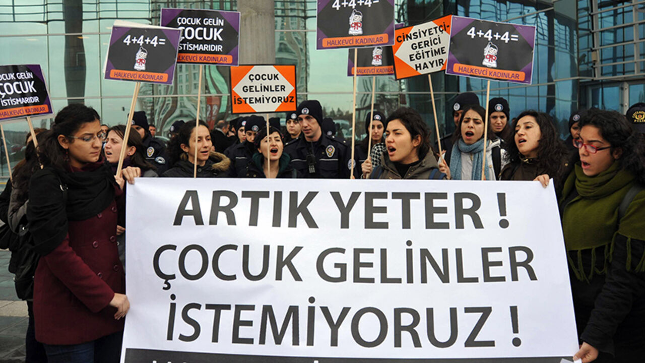 Demonstrators hold a banner reading ''Enough, we don't want child brides'' to protest against child marriage in front of the Family and Social Policies Ministry in Ankara, on February 10, 2014. According to the Turkish Ministry of Interior, in the last three years nearly 135,000 persons below 18 years of age were married in the country, with 20 times more girls than boys. Last year alone the number of under-16 girls whose families applied to the courts to marry them reached 20,000.  AFP PHOTO/ADEM ALTAN    