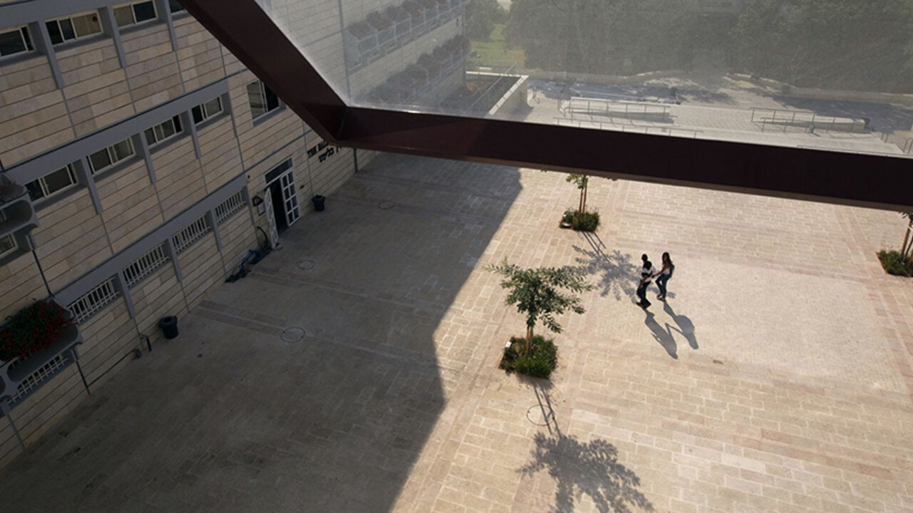 Students walk at the campus of the Ariel University Centre in the West Bank Jewish settlement of Ariel September 13, 2012. An Israeli government move to upgrade Ariel University Centre in the occupied West Bank to a full-fledged university has put the 30-year-old school at the centre of a debate at the core of the Israeli-Palestinian conflict: how the settlements will figure in defining a future Palestinian state. Picture taken September 13, 2012. To match Feature PALESTINIANS-ISRAEL/SETTLEMENTS  REUTERS/Ro