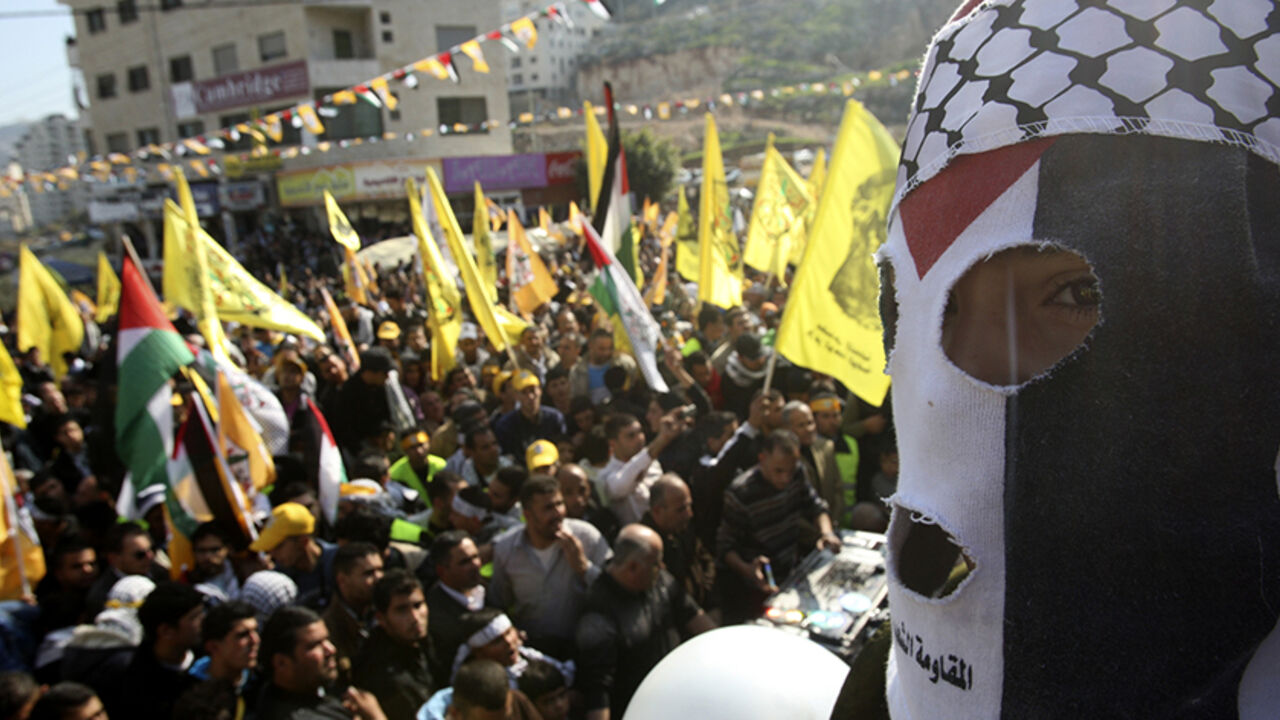 A Palestinian youth takes part in a rally in the West Bank city of Nablus marking the 48th anniversary of the founding of the Fatah movement January 3, 2013. REUTERS/Abed Omar Qusini (WEST BANK - Tags: POLITICS ANNIVERSARY) - RTR3C2NH