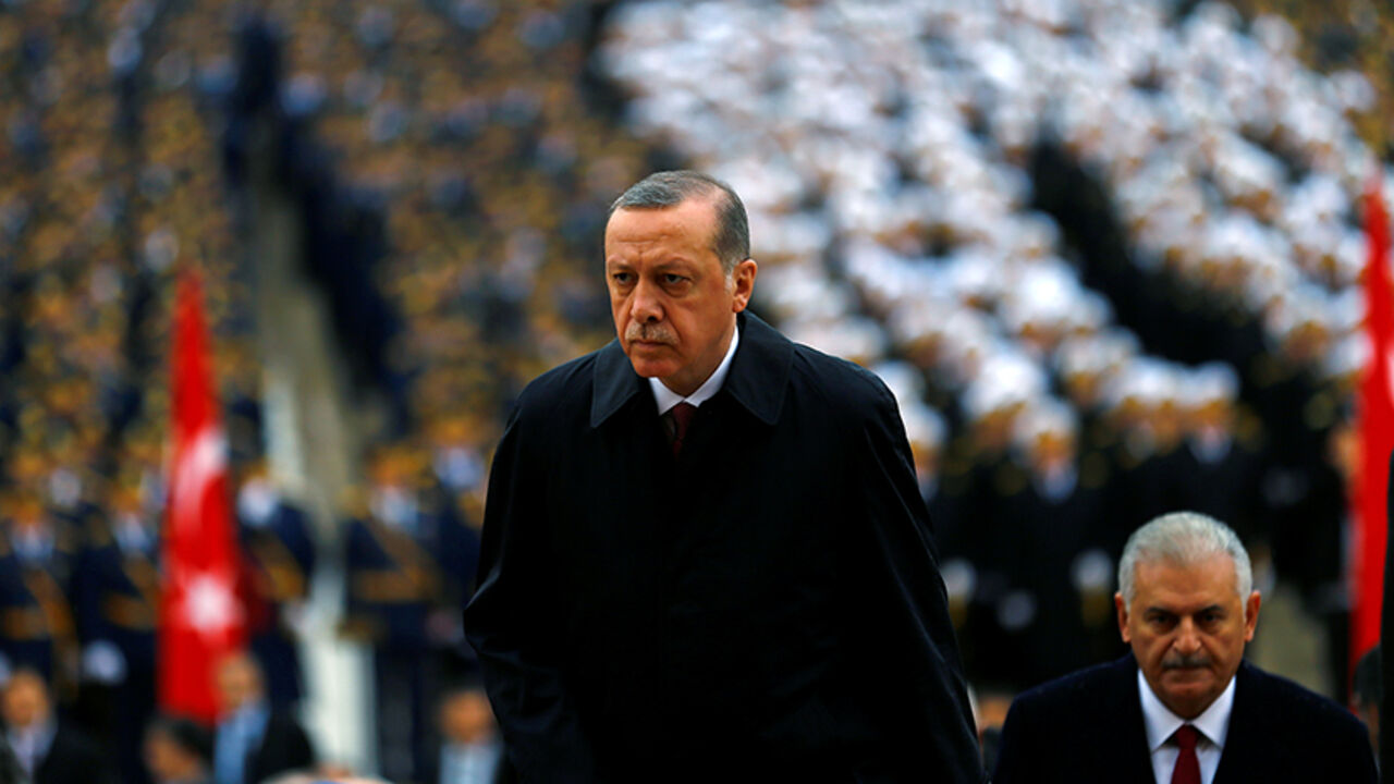 Turkey's President Tayyip Erdogan attends a Republic Day ceremony at Anitkabir, the mausoleum of modern Turkey's founder Ataturk, to mark the republic's anniversary as he is flanked by Prime Minister Binali Yildirim (R) in Ankara, Turkey, October 29, 2016. REUTERS/Umit Bektas - RTX2QXOL