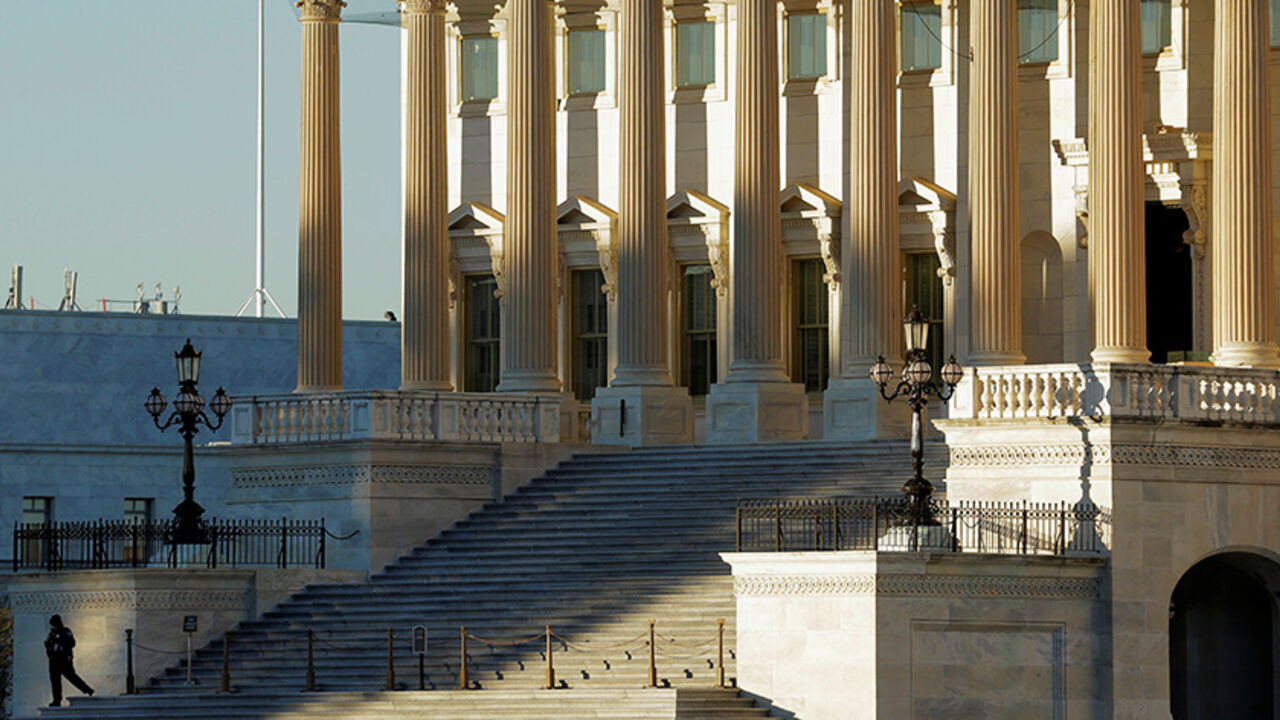A security guard stands on the step to the House of Representatives at the U.S. Capitol in Washington, U.S., November 7, 2016.      REUTERS/Joshua Roberts - RTX2SCP1