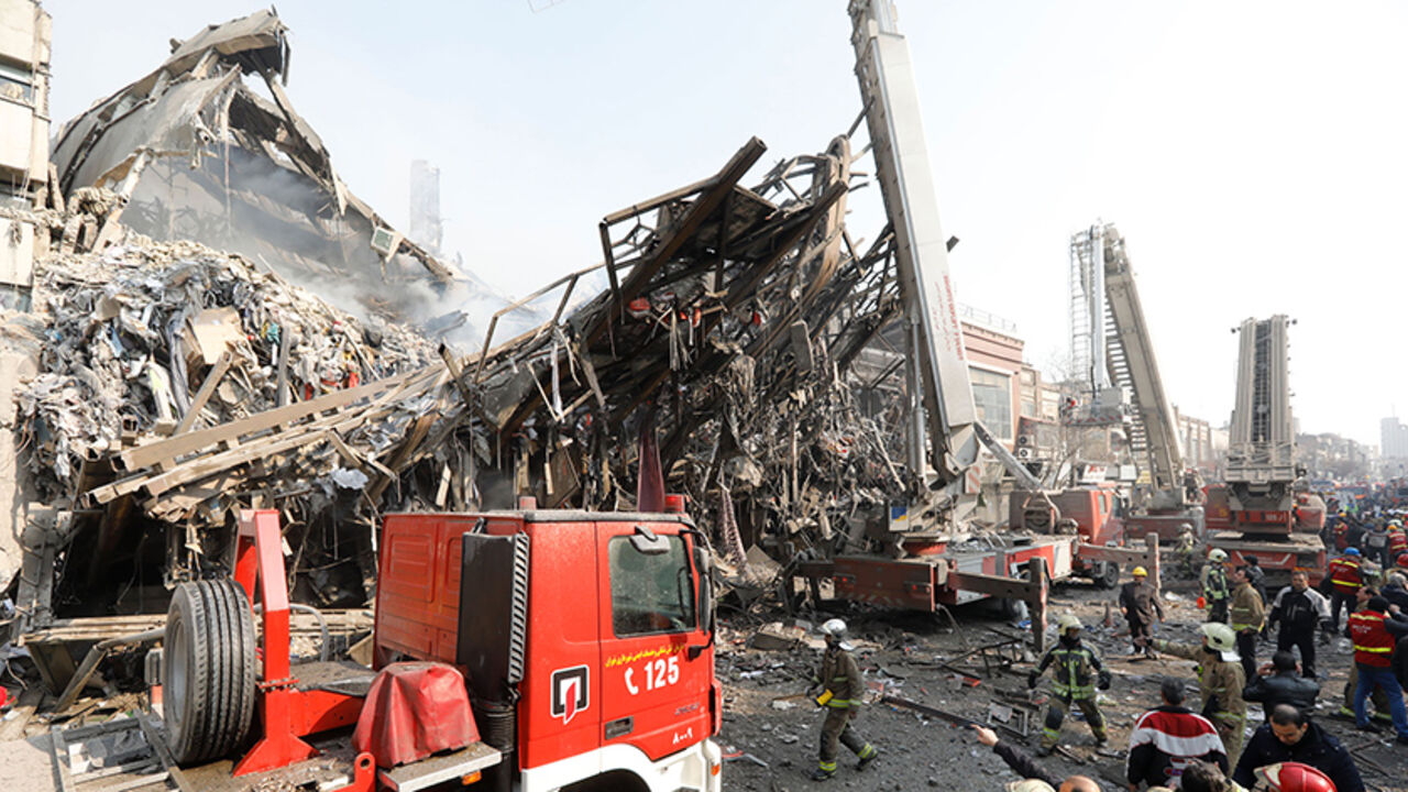 The steel structre of Iran's oldest high-rise, the 15-storey Plasco building, is seen after the collapse of the building in downtown Tehran on January 19, 2017.
State television said 200 firefighters had been called to the scene and 38 had already been injured battling the blaze before it fell. / AFP / STR        (Photo credit should read STR/AFP/Getty Images)