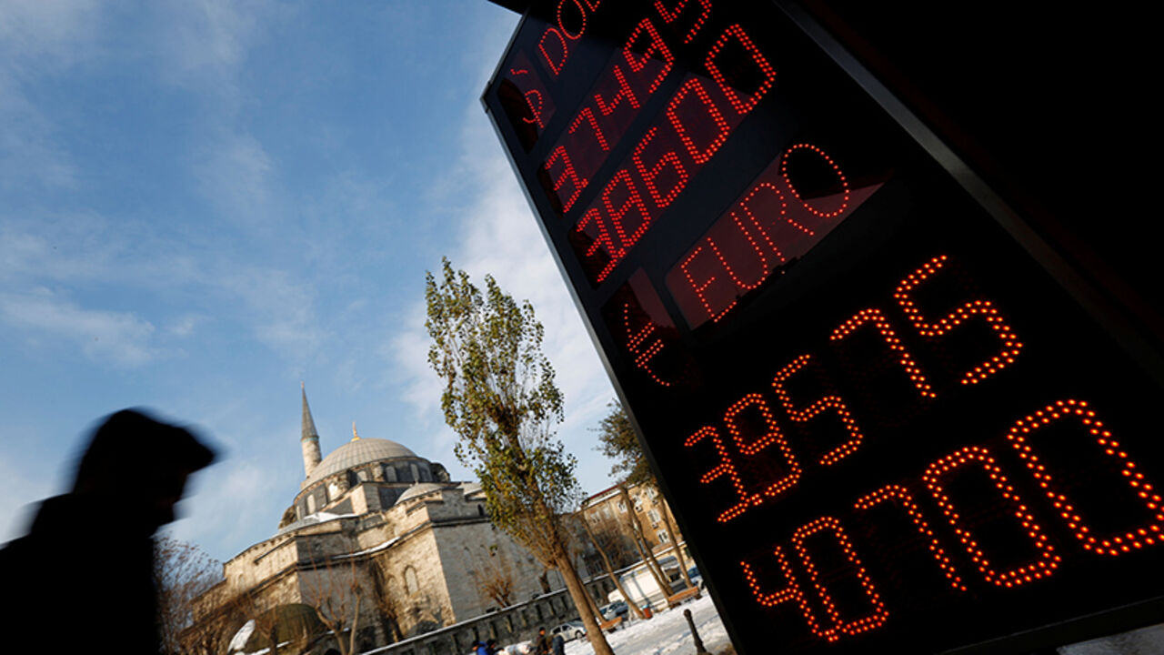 A board showing the currency exchange rates of the U.S. dollar and the Euro against Turkish lira is on display at a currency exchange office in Istanbul, Turkey, January 11, 2017. REUTERS/Murad Sezer - RTX2YFYP