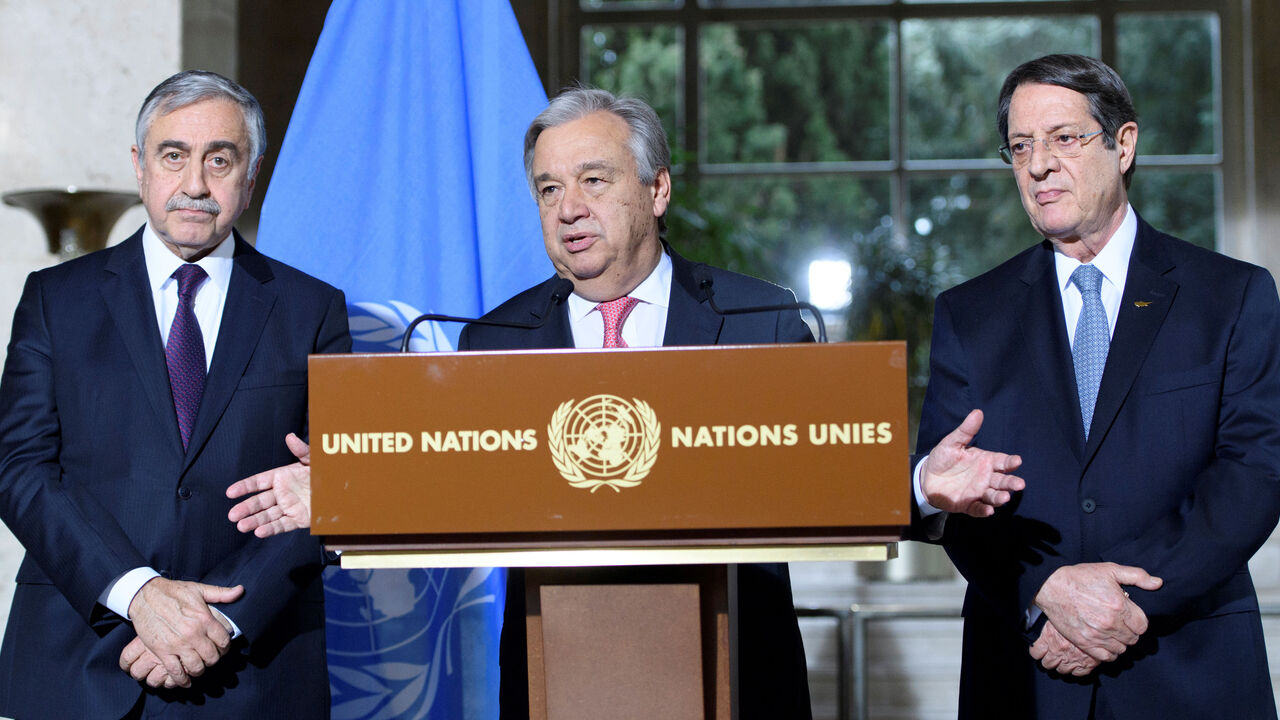 UN Secretary-General Antonio Guterres (C) speaks next to Greek Cypriot President Nicos Anastasiades (R) and Turkish Cypriot leader Mustafa Akinci during a press conference after the Conference on Cyprus, on the sidelines of the Cyprus Peace Talks, at the European headquarters of the United Nations in Geneva, Switzerland, January 12, 2017. REUTERS/Laurent Gillieron/Pool - RTX2YO3Q