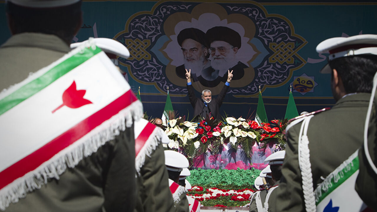 EDITORS' NOTE: Reuters and other foreign media are subject to Iranian restrictions on leaving the office to report, film or take pictures in Tehran.

Hamas Leader Ismail Haniyeh flashes the victory sign during a ceremony to mark the 33rd anniversary of the Islamic Revolution, in Tehran's Azadi square February 11, 2012. Iran's President Mahmoud Ahmadinejad said on the anniversary of the revolution that the Islamic Republic would soon announce "very important" REUTERS/Raheb Homavandi  (IRAN - Tags: ANNIVERSAR