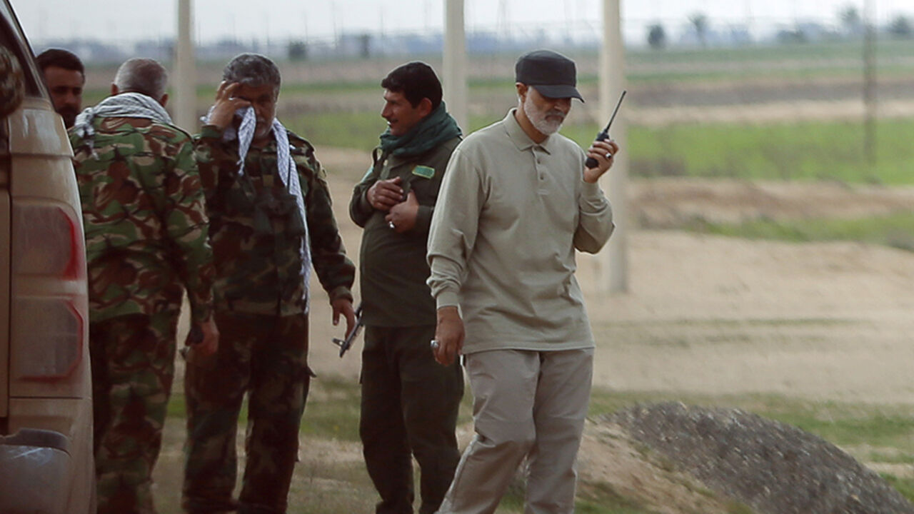 Iranian Revolutionary Guard Commander Qassem Soleimani uses a walkie-talkie at the frontline during offensive operations against Islamic State militants in the town of Tal Ksaiba in Salahuddin province March 8, 2015. Picture taken March 8, 2015.   REUTERS/Stringer (IRAQ - Tags: CIVIL UNREST CONFLICT POLITICS) - RTR4TU0N