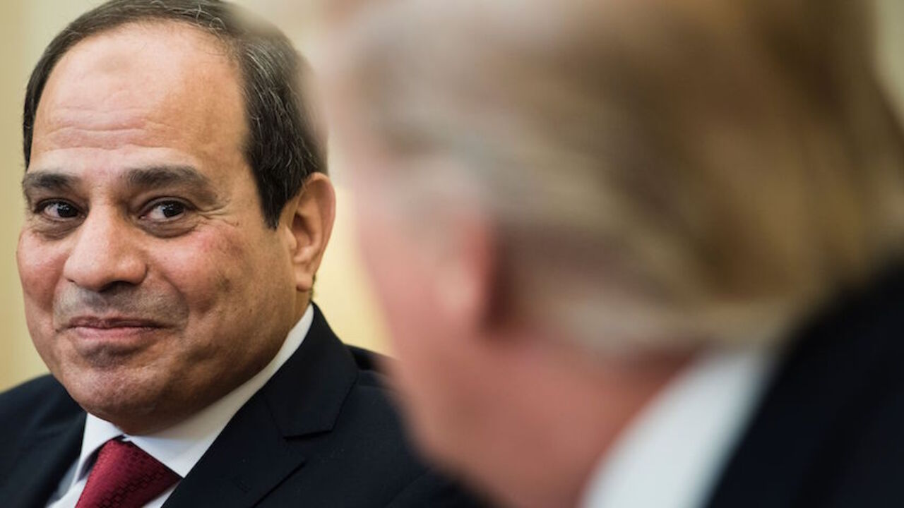 TOPSHOT - US President Donald Trump(R) listens while Egypt's President Abdel Fattah el-Sisi makes a statement to the press in the Oval Office before a meeting at the White House on April 3, 2017 in Washington, DC. / AFP PHOTO / Brendan Smialowski        (Photo credit should read BRENDAN SMIALOWSKI/AFP/Getty Images)