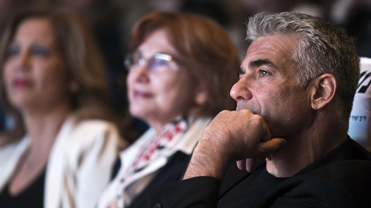Yesh Atid leader Yair Lapid attends a women's committee convention in Tel Aviv March 1, 2015. The era of Prime Minister Benjamin Netanyahu is ending, with Israeli voters clearly more concerned about economic and social issues than about security or fears over Iran, a leading election candidate said on Monday. Lapid, a telegenic former news anchor and TV host, leads the centrist, secular Yesh Atid party ("There's a Future"), which emerged out of the cost-of-living protests that swept Israel in 2011. Picture 