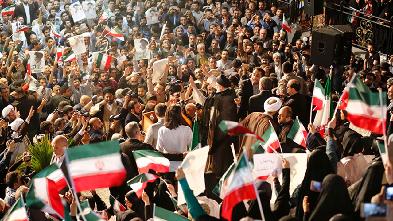 Iranian presidential candidate Ebrahim Raisi greets his supporters during a campaign rally in the capital Tehran on April 29, 2017. / AFP PHOTO / ATTA KENARE        (Photo credit should read ATTA KENARE/AFP/Getty Images)